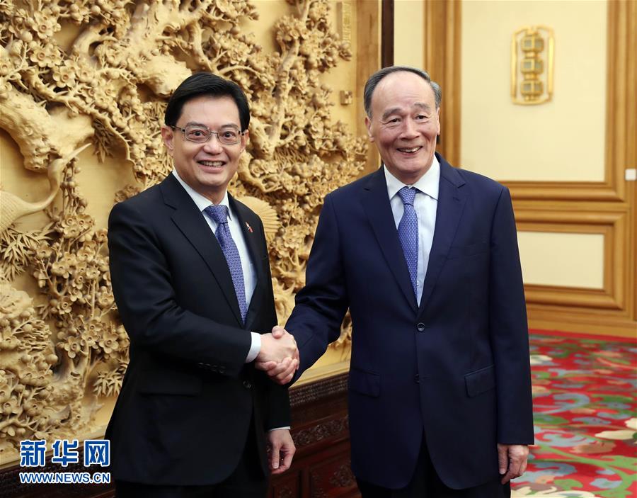 （時政）王岐山會見新加坡副總理兼財(cái)政部長王瑞杰